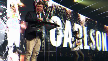 Tucker Carlson speaking at a Turning Point USA event in 2020.